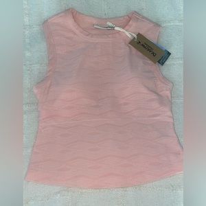 Has built in bra, brand new with tag still on it, breathable material.